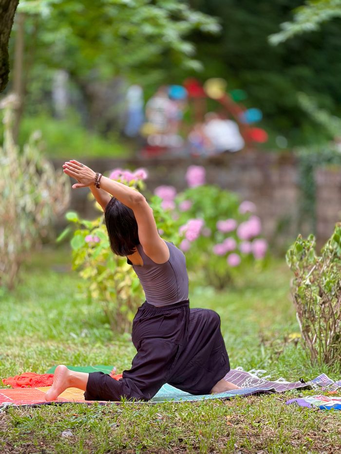 Menu A woman practicing yoga on a colorful mat in a lush garden setting, showcasing relaxation and mindfulness.